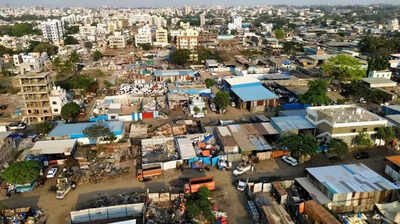 Nashik Industrial investment 2025 aerial view of developing urban area with construction sites, warehouses, and residential expansion."