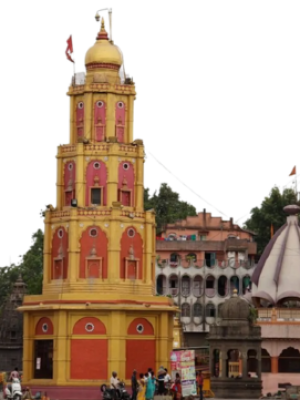 Tranquilstead Nashik, "Colorful Sita Gufa temple tower near Panchavati in Nashik with bustling surroundings