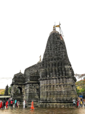Tranquil Stead Nashik, "Trimbakeshwar Shiva Temple in Nashik surrounded by pilgrims during holy rituals